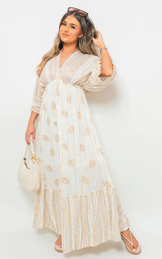 Helena Gold Leaf Print V Neck Maxi Dress with Tassel Detail in Cream | IKRUSH | SilkFred Helena Gold Leaf Print V Neck Maxi Dress with Tassel Detail in Cream | IKRUSH | SilkFred